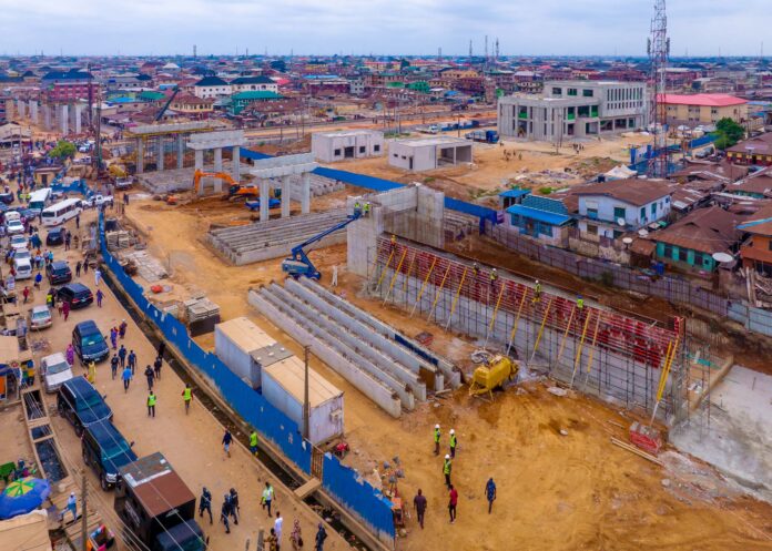 LAGOS RED RAIL LINE NOW AT COMPLETION STAGE - SANWO-OLU •Governor, again, inspects State-owned metro project Lagos State Governor Babajide Sanwo-Olu, on Sunday, again went on an extensive inspection of the ongoing construction activities around the Lagos Rail Mass Transit (LRMT) Red Line project. It’s the fourth time in a year the Governor would be inspecting the pace of work on the 37-kilometre-long rail infrastructure wholly started by his administration, with Sanwo-Olu assuring Lagosians that the rail project would be delivered on its scheduled completion date. The transport infrastructure being developed by the Lagos Metropolitan Area Transport Authority (LAMATA) will have the capacity to transport over 500,000 passengers daily when it becomes operational in the first quarter of next year. The Red Line will traverse on standard gauge from Agbado to Oyingbo, in the first phase, while terminating at Iddo in the second phase. It has eight stations and it is expected to reduce travel by over two hours. Sanwo-Olu, joined on the project tour by the Deputy Governor, Dr. Obafemi Hamzat, and members of cabinet, first stopped at the multi-level Agege Terminal, where he inspected completion work on the facility. The Agege Red Line terminal shares the same yard with Babatunde Raji Fashola Station built by the Federal Government, but stands about 300 metres apart. The Governor also inspected the staff quarters built by the Lagos Government for the railway workers in the employment of the Federal Government. Sanwo-Olu, thereafter, led the team to the iconic Ikeja Station of the Red Line, where 80 per cent of the civil work had been completed. The Governor also checked the progress of the overpass being constructed on Awolowo Way axis to ensure non-interference of vehicular movement on the rail passageway. The Governor stopped at Mushin terminal, to inspect the station and overpass, which stretches between Kayode and Ogunmokun streets, being developed there, before proceeding to Yaba and Oyingbo stations. After the exercise that lasted for four hours, Sanwo-Olu expressed satisfaction on the quality of the work done, disclosing that most of the difficult tasks had been completed. The entire construction, the Governor said, has moved into the finishing phase in which precast beams and other concrete fittings are being coupled to the constructed structures. He said: “The Red Line is a project conceived and started by our Government, which will be delivered in the lifetime of this administration. We have given our commitment to ensure the project is completed by the end of this year as promised. This is our fourth inspection trip on this project within the year alone and each time we come, there is significant progress that the contractor achieves along the rail corridor. “Along the rail corridor, there is massive regeneration that is taking place and we have paid extensive amount in terms of compensation, far more than anyone else, for those affected by the construction activities. That is why we don’t have problem with members of the communities on this corridor. After inspecting the Agege station, we went on to check the Ikeja terminal, which happens to be the iconic station of the Red Line. Its size is almost about the size of three football fields together. “As we have seen, all the stations inspected are at the roof level, moving into the completion stage. The civil work has been completed, it’s just the finishing job we are doing at the moment. All the activities are on schedule and we are hoping the best entire project will be completed by the end of the year. There are places that were particularly challenging for the contractor to do drilling due to high vehicular density. All the challenges have been overcome; what is left is concrete in-situ and placing of precast beams.” Sanwo-Olu said the construction work on the overpasses were at different stages of completion but assured that all work would be done by December. He said the work on the bridge on Awolowo Way onto Agege Motor Road and inward Mongoro Bus Stop remained on track and would finish by the end of October. Sanwo-Olu said the Mushin overpass, which crosses from Kayode Street at Ikorodu Road to Agege Motor Road in Mushin, and the one at Yaba from Tejuosho exiting onto Murtala Muhammed Road, would be completed by November. To eliminate human interference with the rail corridor, the Governor said the rail passageway would be walled off the residential areas. This, he said, would also prevent encroachment and unapproved commercial activities around the corridor.