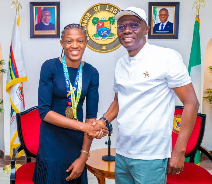 L-R: Commonwealth Gold and World Wrestling Medalist, Odunayo Adekuoroye with Lagos State Governor, Mr. Babajide Sanwo-Olu during a courtesy visit to the Governor, at Lagos House, Marina, on Tuesday, 16 August, 2022.